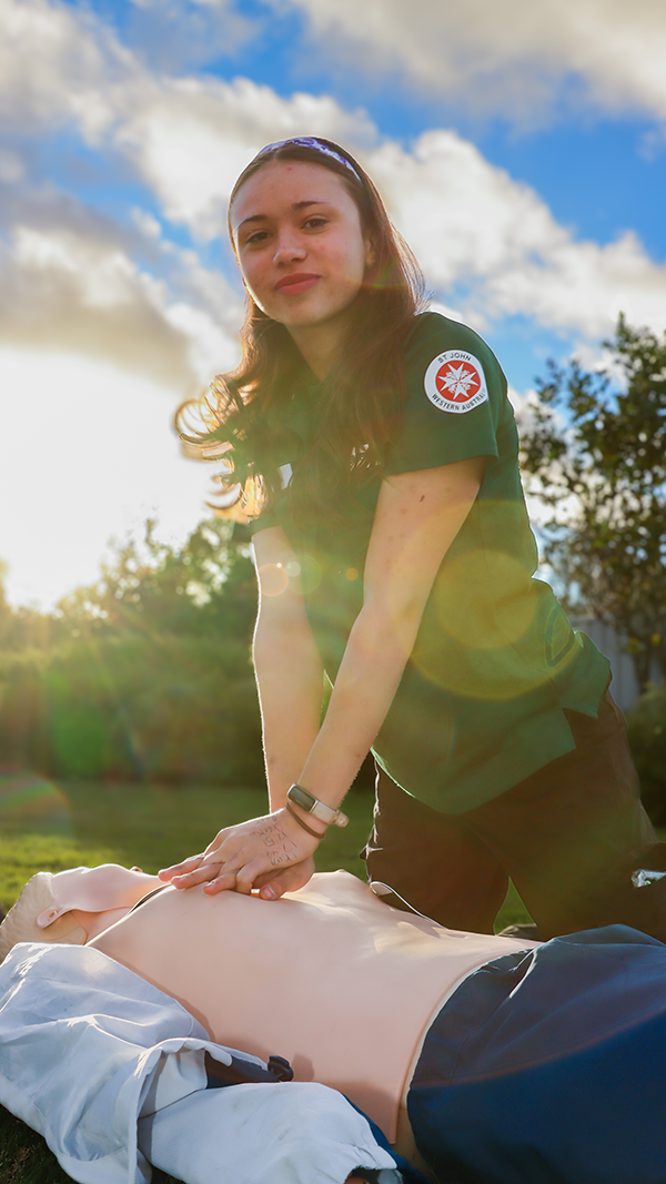 Academy team member performing CPR on dummy