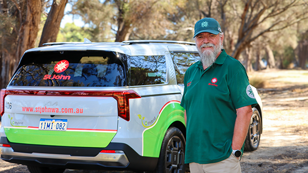 Community Transport Volunteer in front of car